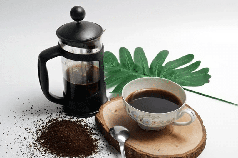 french press coffee with cup of coffee