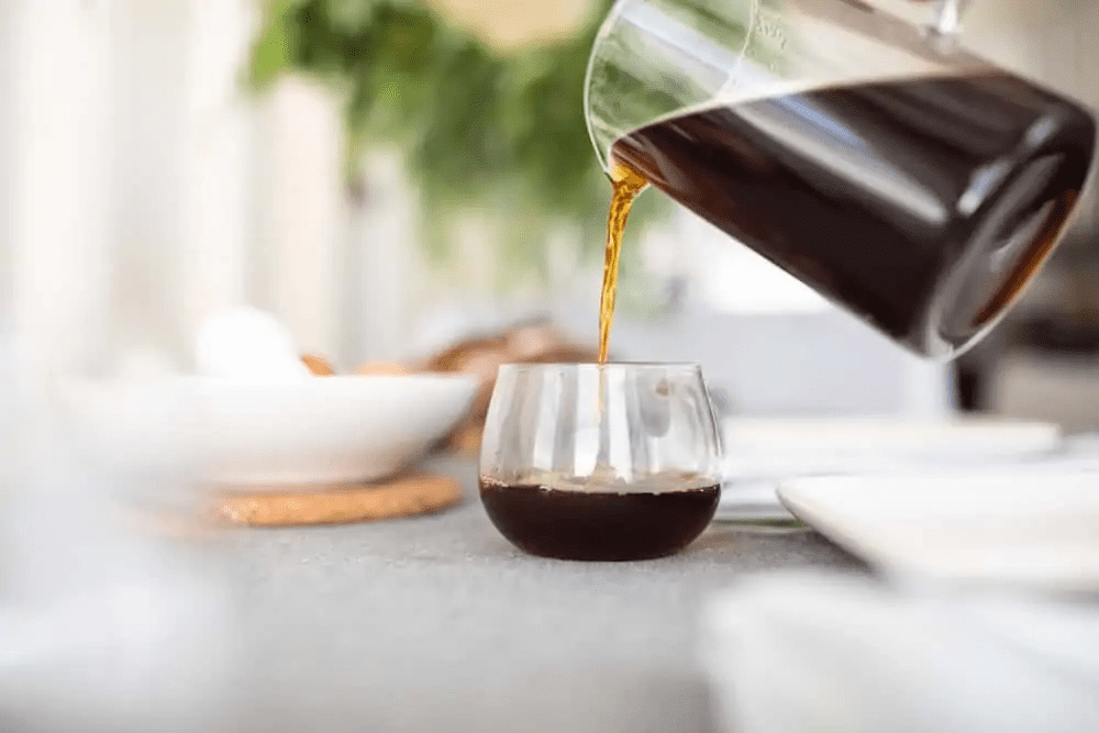 pouring coffee into cup